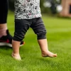 Rolawn Medallion Turf - Baby walking across fresh grass