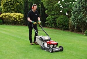 Info centre - spring lawn care mowing a lawn