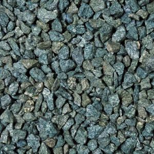 Stunning dark green granite chippings shown wet. Unusual colour, which is striking in most landscaping projects.